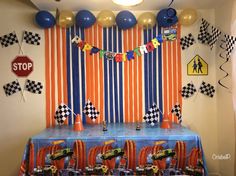 a birthday party with cars decorations and balloons