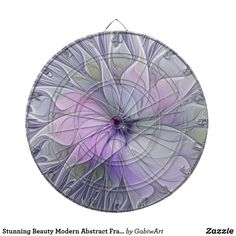 a purple flower is shown in the center of a circular glass plate with an intricate design