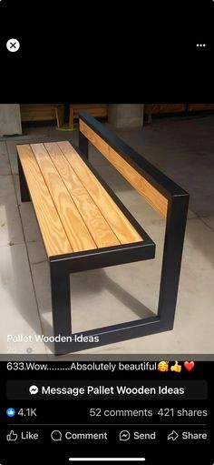 a wooden bench sitting on top of a cement floor