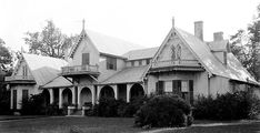 an old photo of a large house in the country