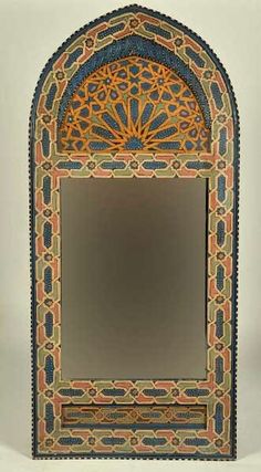 an intricately designed mirror is shown against a white background with blue, orange and yellow accents