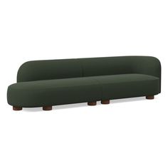 a green couch sitting on top of a white floor