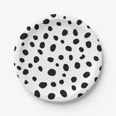 a black and white polka dot paper plate