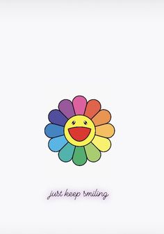 a colorful flower with the words just keep smiling on it's back side and an emoticive smiley face in the middle