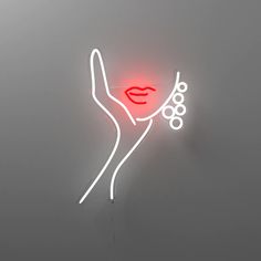 a neon sign with a woman's face on it