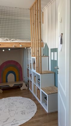 a child's bedroom with bunk bed and play area