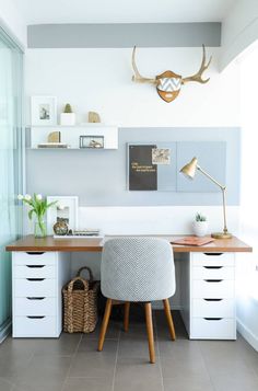 a white desk with drawers and a chair in front of it on top of a tile floor