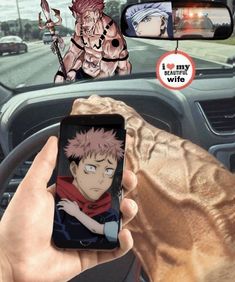 someone is holding up their cell phone to take a picture of the anime character naruto