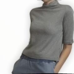 The Temple Top By Mod Ref In Grey Is A Lightweight Top With A 3/4 Sleeve And Cowl Neck For Everyday Wear. 35% Acrylic, 30% Cotton, 30% Rayon, 5% Spandex Casual Gray Tops With 3/4 Sleeve, Half Sleeve Tops For Fall Day Out, Solid Color Tops With 3/4 Sleeve For Day Out, Fitted Half-sleeve Tops For Spring, Fitted Half Sleeve Tops For Spring, Gray 3/4 Sleeve Summer Top, Gray 3/4 Sleeve Top For Summer, Gray Half Sleeve Tops For Spring, Gray Summer Top With 3/4 Sleeves