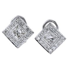 1.28 Princess Cut Diamonds with .55 Total Carat Weight of Pave Halo 18 Karat Gold Earrings Lever Back This pair of earrings showcase two princess cut diamonds set at center with a total weight of 1.28 carat (G/H/VS2) and an additional 0.55 carat of pave-set diamond are set in halo (F/G/VS). These are flawlessly elegant diamond earrings. These earrings measure 10 x 10 mm square. Princess Cut Diamond Earrings, Diamond Gold Earrings, Two Princess, Vintage Stud Earrings, Princess Cut Gold, Diamond Gold, Art Deco Jewelry, Princess Cut Diamonds, Princess Cut