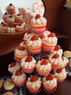 cupcakes and muffins are arranged in the shape of a christmas tree