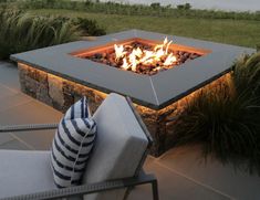 a fire pit sitting on top of a stone patio