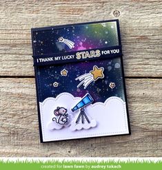 a handmade card with an image of a rocket and a mouse on it, that says thank lucky stars for you