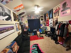 a room filled with lots of clothes and pictures on the wall