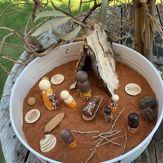 a white bucket filled with lots of different types of candies and other things in it