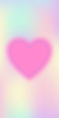 a blurry image of a pink heart on a blue and green background with white border