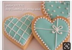 three decorated cookies in the shape of hearts