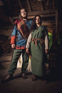 a man and woman dressed in medieval clothing