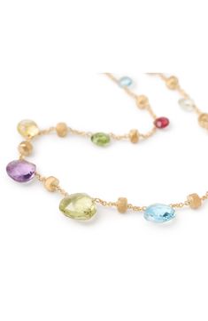 A rainbow of semiprecious briolettes interspersed with hand-engraved 18-karat-gold nuggets brightly details a delicate chain-link necklace. 16" length Lobster clasp closure 18k gold/tourmaline/topaz/amethyst/quartz/rhodolite/iolite Made in Italy Marco Bicego, Gold Nugget, Delicate Chain, Station Necklace, Amethyst Quartz, Chain Link Necklace, Link Necklace, Hand Engraving, A Rainbow