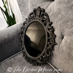 an ornate mirror on the back of a couch