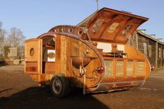 an old camper is parked in the dirt