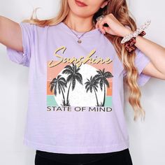 Looking for a cute versatile top to wear? Make sure to grab one of our Graphic Tees! This soft and comfortable graphic Tee is the perfect top for any outfit. It can be paired with biker shorts, jeans, or even a simple skirt/dress! This Tee is true-to-size, so be sure to order your regular t-shirt size! If you are looking for a more oversized look, make sure to size up! Trendy Purple Tops With Letter Print, Casual Purple Top With Graphic Print, Purple Short Sleeve Vacation Tops, Purple Short Sleeve Top For Vacation, Purple Slogan Tops, Spring Lavender Letter Print Top, Trendy Purple Slogan T-shirt, Lavender Trendy T-shirt For Summer, Trendy Lavender Summer T-shirt