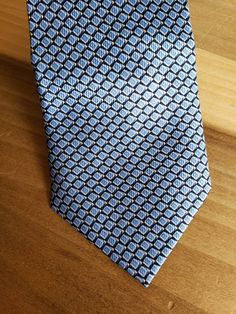 This is a vintage, Nautica, silk, necktie. It is a very nice blue pattern. This tie measures 59.75 inches in length x 4 inches at the widest part. Don't forget to stop in at my other Etsy shop... http://www.etsy.com/shop/xtdesigns. Follow me on Twitter at... MyYiayiaHadThat@MyYiayiaHadThat. If you have a wish list or are looking for something specific, please ask. I may have exactly what you are looking for. As always please convo me with any questions or concerns regarding this item or with any Blue Standard Tie For Formal Suit, Blue Formal Suit And Tie Accessories, Blue Tie With Pocket Square For Business, Blue Ties With Pocket Square For Business, Classic Blue Neckwear For Black Tie Events, Blue Standard Tie For Formal Occasions, Blue Semi-formal Necktie, Blue Semi-formal Standard Tie, Classic Blue Neckwear For Semi-formal Occasions