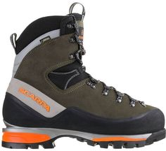 a pair of hiking boots with orange soles on the bottom and black outstep