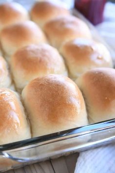 bread rolls in a glass baking dish on a table