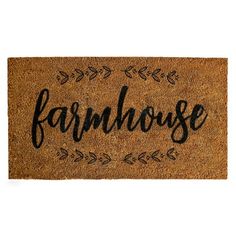 a door mat with the word farmhouse on it and an arrow design in black ink