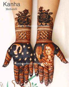 two hands decorated with henna designs and stars