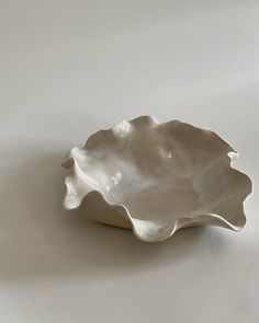 a white bowl sitting on top of a table