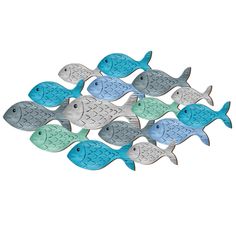 a group of small metal fish on a white background with blue, green and gray colors