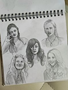 a drawing of four different women on a piece of paper