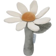 a stuffed flower on top of a gray object