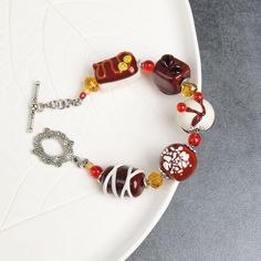 "Indulge in the sweet style of this chocolate candy bracelet! This kawaii bracelet for women features a chunky design that's perfect for adding a touch of fun to your look. The charming chocolate candy beads make this bracelet a unique and playful accessory.  💕 You will definitely look stunning with this glass sweets bracelet! 👉 Please note that this bracelet has a fixed size and is designed to fit a wrist circumference of 15.5-16.5cm (6.1\"- 6.5\" inches). If you require a smaller or larger s Kawaii Bracelet, Chocolate Jewelry, Candy Beads, Candy Bracelet, Jewelry Chunky, Chocolate Food, Miniature Food Jewelry, Candy Jewelry, Chunky Bracelet