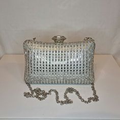 Womens silver mirror crystal diamond embellished evening clutch bag with silver embellishment, metallic satin finish material and crystal detailed top closing clasp Can be used with or without long shoulder chain (included) size approx- H 12cm x W 20cm Free Royal Mail delivery is an estimated 3-5 days but this can occasionally be slightly longer which solely on the Royal Mail side. We do offer guaranteed next day delivery but please contact us prior to ordering as this would incur a small upgrad Rectangular Sparkling Evening Clutch, Formal Sparkling Clutch, Rectangular Rhinestone Evening Bag, Glamorous Rectangular Evening Bag For Dinner, Silver Crystal Bag For Party, Silver Crystal Clutch With Rhinestones, Silver Rectangular Crystal Bag, Sparkling Clutch Evening Bag For Formal Occasions, Silver Crystal Rectangular Bag