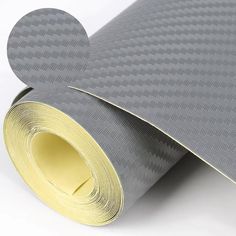 a roll of gray and gold colored paper