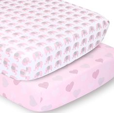 two sheets with elephants on them, one in pink and the other in grey are laying next to each other