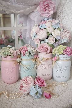 pink and blue mason jars filled with flowers