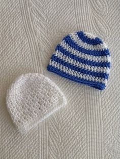 two crocheted hats sitting next to each other