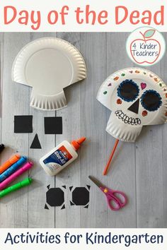 paper plates, scissors, markers and other crafting supplies are arranged on a table