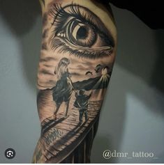 a man with an eye tattoo on his arm