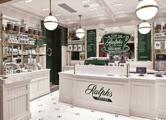 the interior of a coffee shop with green and white signs