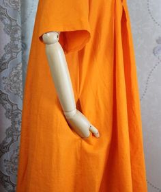 "【Fabric】 Cotton, linen 【Color】 orange 【Size】 Shoulder width 39cm/ 15.2\" Sleeve Length 29cm / 11\" Cuffs around 40cm / 6\" Bust 114cm / 45\" Waist circumference 170cm/ 66\" Length 112cm / 44\" Hem circumference 236cm/ 92\" Washing & Care instructions: -Hand wash or gently machine washable do not tumble dry -Gentle wash cycle (40oC) -If you feel like ironing (although should not be necessary) , do it with steam or while the dress is still slightly wet -Do not bleach If you like this dress, p Summer Cotton Maxi Dress With Pockets, Orange Short Sleeve Sundress Maxi Dress, Orange Short Sleeve Maxi Sundress, Orange Short Sleeve Midi Dress For Summer, Orange Short Sleeve Midi Summer Dress, Orange Short Sleeve Summer Midi Dress, Orange Short Sleeve Sundress, Orange Sundress With Short Sleeves, Summer Orange Short Sleeve Midi Dress