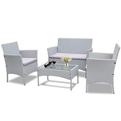 white wicker patio furniture set with glass table