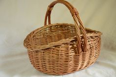 an empty wicker basket on a white background