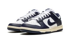 Elevate your sneaker game with these Nike Dunk Low Vintage Navy sneakers in size 10.5W/9M. The low top shoe shaft style provides a sleek and stylish look, perfect for any casual occasion. The blue colorway and W shoe width make these sneakers a must-have for any fashion-forward woman. Made with quality materials, these Nike Dunk Low sneakers are designed to last. The FN7197-100 style code and Nike Dunk product line ensure that you're getting a top-notch product from a trusted brand. Perfect for Nike Dunk Low Vintage Navy, Blue Dunks, Nike Heels, School Pack, Nike Branding, Skor Sneakers, Retro Basketball Shoes, Navy Sneakers, Retro Basketball