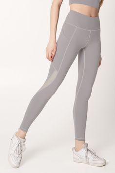 Have all eyes on you in and out of the studio with our beautiful Silver Grey leggings. With a stable elastic at the waistline, these high-rise yoga pants provide a powerful, contoured silhouette on different figures. Nicely placed seams and breathable mesh panels create a perfect blend of sporty and chic. They feature deep side drop-in pockets that are large enough to fit all of your essentials. Breathable, sweat-wicking and lightweight fabric is silky soft with a move-with-you feel. So cozy and stretchy to keep you cool during any training. Awesome staple for yoga, Pilates, barre and other sweat sessions. Rock with a matching strappy top for a sleek look. Buttery-soft. Feels like a second skin. 4-way stretch that moves with you. Stay in place. Not sliding down! Opaque fabric. Not see-thro High Rise Yoga Pants, Mommy And Me Swimwear, Sporty Crop Top, Neon Dresses, Sport Bikinis, Girls Lace Dress, Pilates Barre, Mommy And Me Dresses, Girls Unique