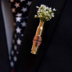 a boutonniere with flowers in it is on the lapel of a man